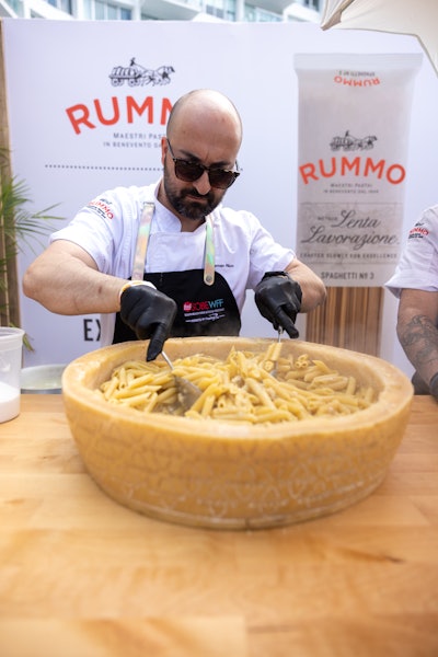 Chef German Rizzo cooked and served penne from a cheese wheel as part of the Rummo pasta partnership.