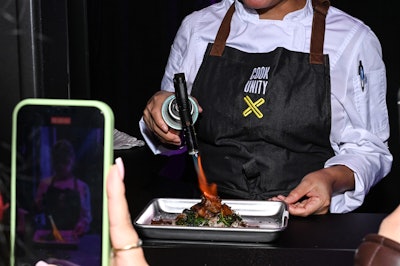 Private booths offered a behind-the-scenes peek at chefs in action as they prepared dishes live.