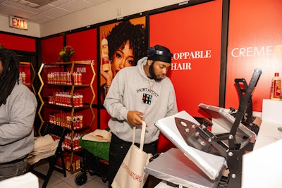 Event producers prioritized hiring BIPOC-owned vendors. One such event partner, The Maker Lab, provided a station where guests could create branded tote bags to fill with Creme of Nature products.