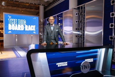 The three-floor activation featured several touchpoints in homage to Inside the NBA, including the Big Board Race, a “Who He Play For?” interactive station, and highlights and viral moments from the show’s history. On the top floor of the experience was the Card Member Club, an exclusive space for Amex cardmembers where they could customize merch and listen to fireside chats between NBA players and broadcasters, including TNT’s Ernie Johnson (pictured), who stopped by for one-on-one chats throughout the weekend.