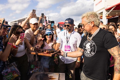 Guy Fieri grilled steaks for the Sunday crowd while promoting the Guy Fieri Foundation.