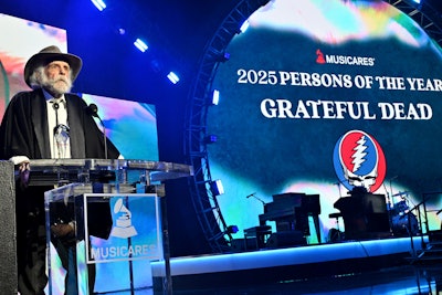 Honoree Bob Weir of The Grateful Dead accepted the 2025 MusiCares Person of the Year award onstage. Throughout the night, QR codes soliciting contributions appeared not only on screens, but also on the cardstock handout left on each table seat. Attendees could also participate in Julien's Auctions and MusiCares' Charity Relief Auction, through which they could bid on one-of-a-kind music memorabilia, including the suit Jerry Garcia wore on the cover of the Dead's 1980 studio album, Go to Heaven (valued between $10,000 and $20,000), and other items from stars like Dua Lipa, Stevie Nicks, and Bruce Springsteen.