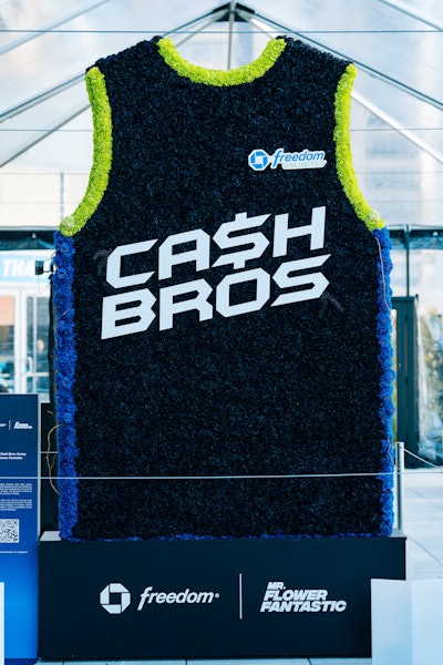 Multidisciplinary artist Mr. Flower Fantastic designed custom basketballs, totes, and crewnecks as giveaways and unveiled a one-of-a-kind 8-foot-tall Chase-themed jersey.