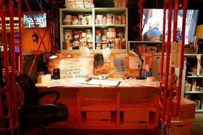 The space was filled with authentic show artifacts from the last 50 years, including real wigs (i.e., Stefon, Wayne, and Garth), actual costumes (i.e., Moo Deng, Landshark), and props (i.e., Bass-o-Matic, Laser Cats ET, original cue cards), all of which had been carefully transported over from Studio 8H.