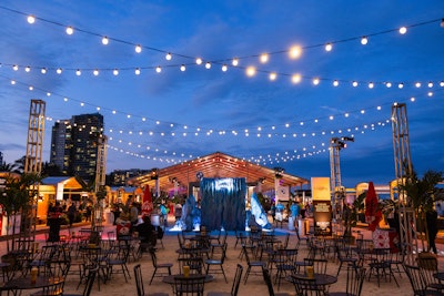 Although the North Tent venue turned over each night for a different themed event, the core of the beachside courtyard offered the same setup with plenty of seating under streamed lights on the sand and the Icelandic Glacial water footprint nearby so guests always knew where to hydrate.