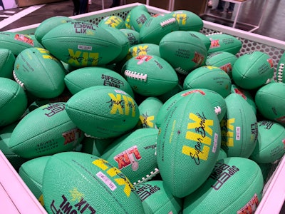 Wilson's activation displayed historic footballs from Super Bowls; fans could also purchase special LIX footballs (pictured).