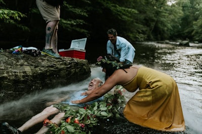 Photographer Rob Yaskovic gifted attendees with one of his water portraits—if they were willing to submerge themselves in the creek.