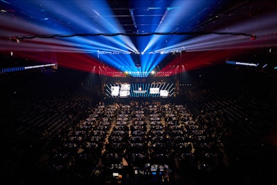 The arena was filled with a mix of banquet tables and stadium seating.