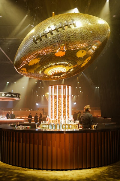Uber One members celebrated the evening alongside A-list athletes and celebs—along with a giant gold football that served as a bar centerpiece.