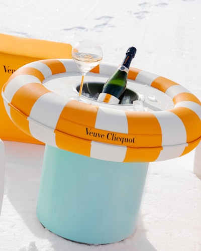 The après-ski moments, inspired by Veuve Clicquot's solaire yellow hue, spotlight the brand's newest release, RICH.