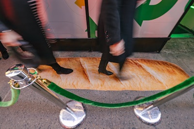 Attendees walked the 'bread' carpet before entering the experience.