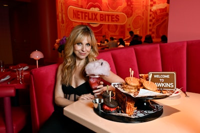 Stranger Things actress Cara Buono stopped by the preview event to sample a few Netflix Bites Vegas specialties, including Eleven's Feast of chicken and waffles, and the cotton candy-topped Mind Flayer cocktail, which infuses Maker's Mark bourbon, lemon juice, blackberries, St. Germain, Giffard Crème de Mûre, and ginger syrup.