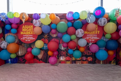 A photo wall layered in colorful lanterns was a festival finale photo pit stop.