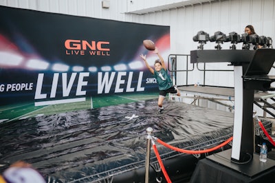 GNC's activation featured a smoothie experience where attendees could taste the flavors of vanilla and chocolate whey protein before making their way over to dive into a football catch photo moment. Other on-site activations came from Anheuser-Busch, TickPick, Sabra, Verizon, Hellmann’s, Natalie’s Juice, Flavortown Cookware and Kitchen Essentials, Flavortown Sauce, and Santo Tequila.