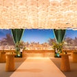 'The umbrella ceiling was a visual highlight and one of our favorite design elements,' said UNBOXED GROUP's Kyle Absolom. 'It featured over 600 white umbrellas, backlit to create a soft glow in that area.'