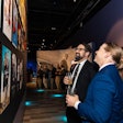 Two friends debate their favorite James Bond at an exclusive party at the International Spy Museum's 'Bond In Motion' exhibit.