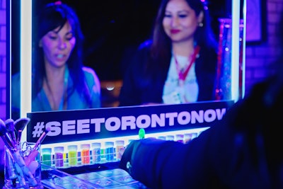 The Glow Up In The 6ix glam station provided festival-inspired hair and makeup styling, glitter, and glow-in-the-dark tattoos.