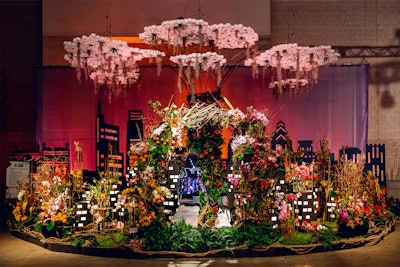 Robertson’s Flowers & Events scored the second-highest amount of points in the Floral category with its exhibit, 'Tending Our Roots.' The design takes inspiration from the proverb, 'One generation plants the trees; another gets the shade.” The 'tree of life' figure in the center is drawn from a real-world park in Singapore focused on sustainability and is meant to symbolize the efforts of the current generation in planting seeds for a future filled with environmental benefits. Beneath the canopy is a cityscape 'where our roots connect us through a common weave under the promise of a shared sunrise,' the Robertson's team shared on social media.