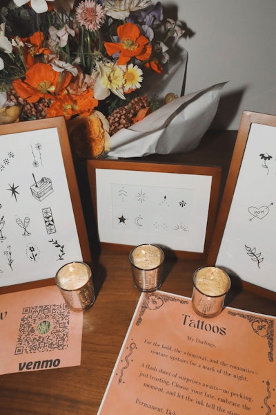 A live tattooing station featured illustrations from the invitation.