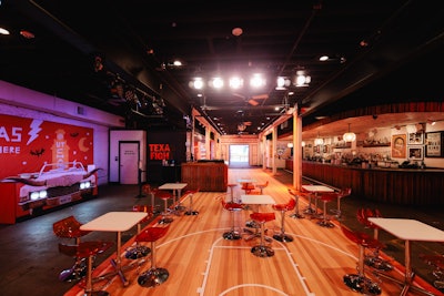 A basketball court covered the entire first floor. More than 5,900 guests stopped by the house to experience event partners like Armadillo World Headquarters, 47 Brand, Raising Cane's, Snoopslimes, Kendra Scott, and Tiff's Treats, and to listen to panels about the campus’ innovations and initiatives.