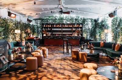 Highlighting interior design features such as the signature high-gloss woods and black marble accents, all custom pieces brought in seamlessly incorporated the same materials. The usual fine dining setting was transformed into an elevated lounge with rich velvet and boucle furnishings in a warm palette of deep chocolates, cognac, and pops of deep emerald.