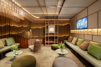 Layers of airy tulle were imprinted to evoke the fluid contours and soft palette of a mountain landscape, set off by lighting diffused through sheer curtains. Across one side of the room, there was a sequence of cutouts representing native species, while the earthy colors and textures of the sofas, chairs, and tables completed the canvas.