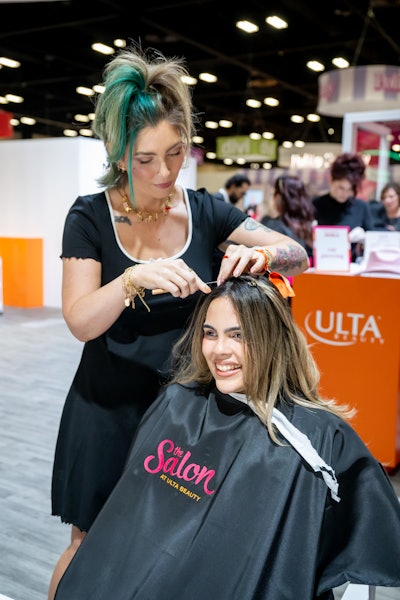 At the Ulta Beauty Salon Services booth, attendees were able to get makeup and hair tutorials as well as ear piercings.