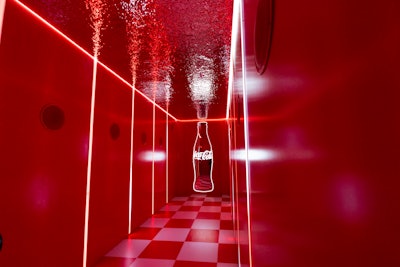 As guests entered, they were immediately immersed in the rich history of the brand by walking through a 'soundsorial' corridor featuring the sounds of fizzing bubbles, pouring, and popping open a Coke.