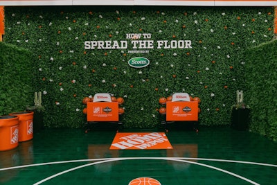 Fans had 30 seconds to take as many shots as possible from various points on this branded court, each worth different point values—including a three-point shot from The Home Depot logo with an oversized Scotts seed spreader rebounder. Fans played for 'Phil the Bucket' hats, arm sleeves, and Home Depot gift cards.
