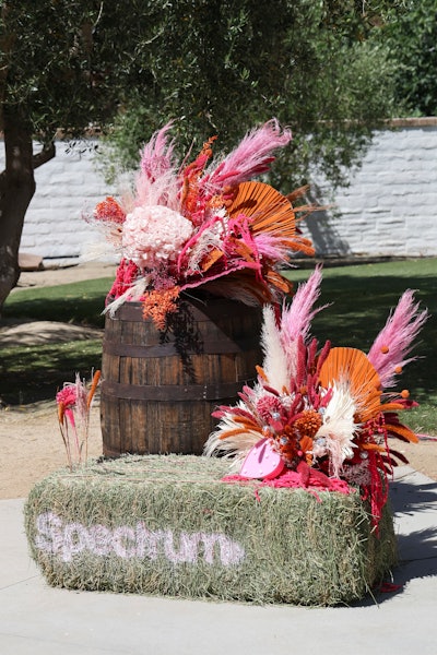 Activations and decor throughout the space leaned into Western-style hay bales and desert-inspired florals.