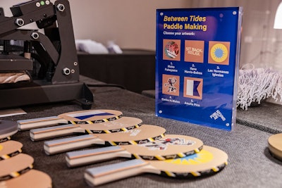 The paddle keepsakes featured designs from Carlos H. Matos, Ilana Harris-Babou, Las Hermanas Iglesias, Moko Fukuyama, and Amalia Pica.