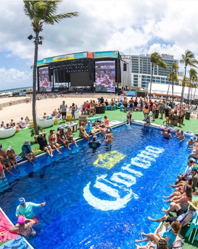 There was also a branded pool, along with a space to customize cowboy hats by selecting from a variety of branded accessories. Attendees also had the opportunity to sample and purchase Corona Sunbrew at the Sunbrew bar, which also had an oversize photo op that capitalized on the beach backdrop.