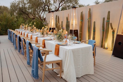 The welcome dinner took place at a communal table flecked with decor in desert-inspired hues. The Valley handled furniture rentals, while Let’s Bash provided tabletop rentals.