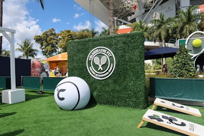 The space featured cornhole, an oversize tennis ball, and an interactive tennis racket wall. Guests were gifted single-serving drink packets to help them boost energy while enhancing fun.