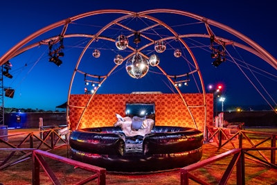 In the Coach activation, guests could also ride a mechanical bull beneath glittering disco balls. Event Eleven worked with 3 Line Productions on fabrication; Pro Systems on lighting, audio, and video; Lighten Up on lighting; Stage-Tech on staging; FormDecor and Cosmos on furniture; Choura on tenting; Bright Rentals on rentals; and JRM on security.