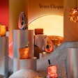 In 2022, Veuve Clicquot celebrated 250 years with Solaire Culture, the company's first-ever global traveling exhibition. The experience evoked Veuve Clicquot’s legacy through a variety of installations—including works from 10 woman artists who were asked to create original pieces inspired by Madame Clicquot and the Champagne house. The exhibition featured museum-like rooms that highlighted the history of the brand. More than 80 archival objects and historical pieces were on display—and in one photo op-friendly room, bottles were treated like works of art. See more: Veuve Clicquot Celebrated 250 Years by Honoring Its Audacious Namesake