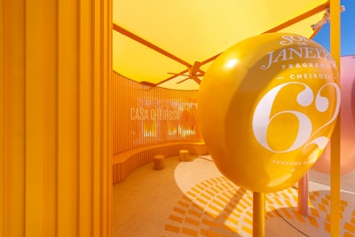 Additional standout features included the Rio orelhões—dome-shaped public phone booths known as “big ears”—that were creatively reimagined into colorful scent portals, wrapped in original artwork to capture each Cheirosa’s mood and identity. The space also featured ambient scent pods and a DJ-powered lounge, plus the House Mini Bar, where guests built a Festival Survival Pouch with body care minis, hydration essentials, and their chosen fragrance.