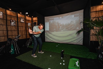 A golf simulator courtesy of Comcast Business brought a bit of healthy competition to Augusta After Dark.