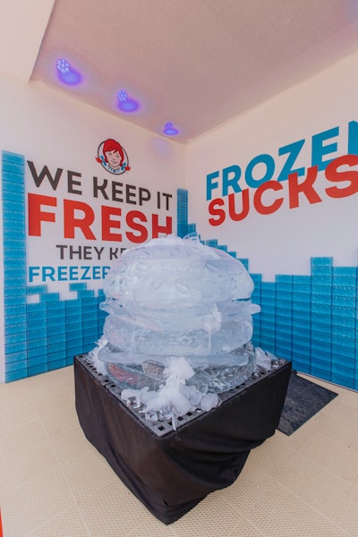 A giant ice sculpture in the shape of a hamburger was a playful nod to the fast-food chain's motto: 'Fresh Never Frozen.'