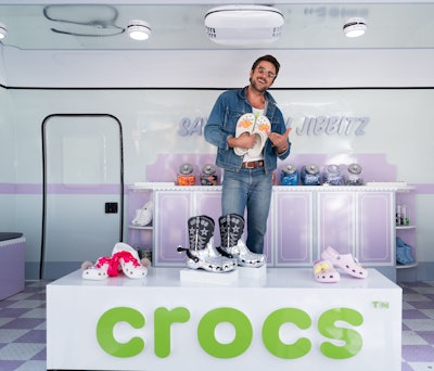 Celebrities like Brandon Sklenar (pictured) and Jessie Murph stopped by to customize their own pair of Crocs.