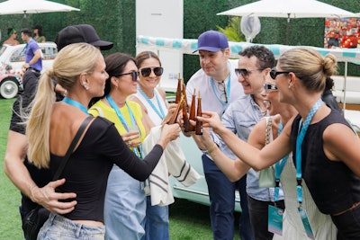 VIP guests toast to Race Day with curated mini cocktails presented in single-serving Don Julio 1942 bottles.