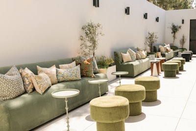 Custom lounges by Found Rental Co. framed the venue’s interior, while 24 Carrots Design provided intricate floral installations and signage. The event also featured lighting by Premier Lighting, entertainment by Dart Collective, linens from Luxe Linen, and additional details from The Bleu Dahlia and Gen X Graphics. The Colony House can hold as many as 400 people for events.