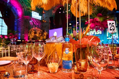 Each table was anchored by an ice bucket adorned with fringe feathers.