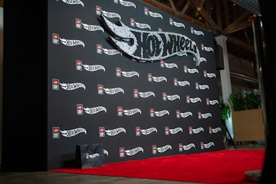 Additional highlights included a Speed Build Challenge; a branded step-and-repeat featuring an 8-foot-long, 50-pound Hot Wheels logo; and a display of luxury vehicles—including an Acura NSX and a Maserati—parked outside the venue to draw attention and photo ops.