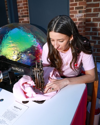Megan Mussari of Apprvl was on site customizing sweatshirts for guests using an antique chain-stitching embroidery machine.