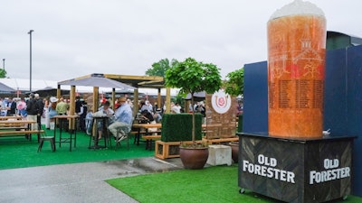 A giant branded mint julep glass stood just outside the seating area of the Woodford Reserve Paddock Plaza.