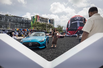 After posing with up to 14 on-site vehicle displays, fans could step inside a larger-than-life F1 helmet to show off their driving skills behind the wheel of a racing simulator.