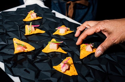 In 2024, Doritos celebrated its new nacho cheese-flavored spirit, in partnership with Empirical, with a design-forward event presented by Eater. Doritos bags and Dorito-shaped triangles were used as decor; the theme also extended to elevated cocktail party bites—ranging from yellowtail crudo to cheesecake—which all incorporated Doritos chips and flavors. See more: This Stylish Launch Party Used Doritos as Decor (Yes, Really)