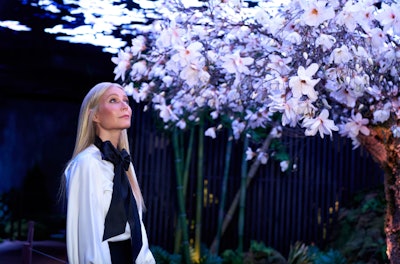 On May 9, Genesis debuted The Forest Within, a multisensory installation at Genesis House in New York developed in collaboration with Gwyneth Paltrow. The exhibit transforms the venue’s Cellar Stage into an immersive environment inspired by Korean landscapes and cultural symbolism. Guests are guided by Paltrow’s narration through a symbolic forest filled with native greenery, rock formations, and a blend of sensory details like ambient sounds, botanical scents, and layered textures. Digital elements—including LED visuals—enhance the journey, merging technology with nature to create a calming, immersive atmosphere.