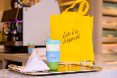 Custom cups, hearts, lids, and even minor details like heart-shaped lid stoppers further blended the two brands. Guests were welcomed with signature drinks—including the exclusive TOMS Cup of Joy—and early attendees received free TOMS sunglasses.